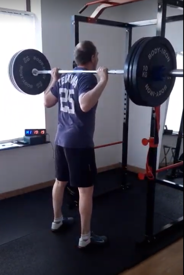 Personal trainer for male personal training of barbell squat